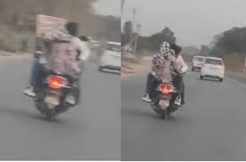 सड़क पर मौत को दावत देता रोमांस, स्कूटी सवार कपल का वीडियो वायरल